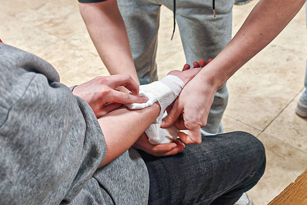 istock First aid practice for bandaging an injured arm 2205878942