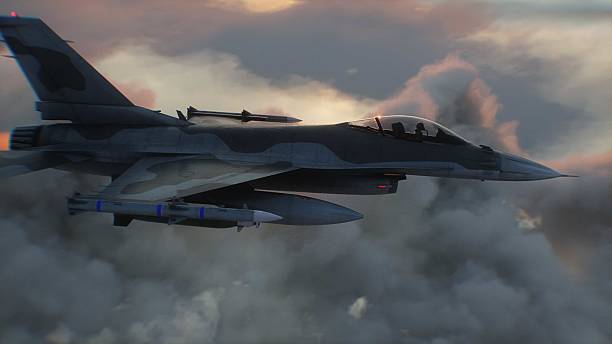 istock Military fighter jet F-16 flying over clouds. Air force. 3d rendering. 2205883253