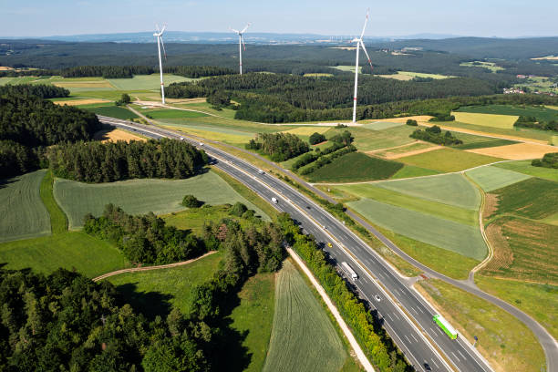 istock Highway, wind turbines, rural landscape 2205885034