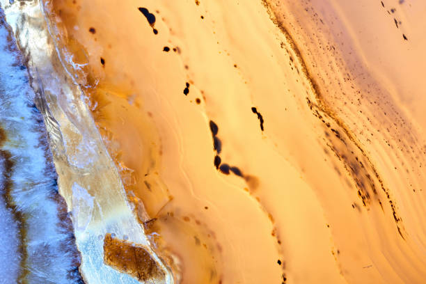 Agate macro detail. close-up of a textured semi-precious gemstone background. backlight transparency