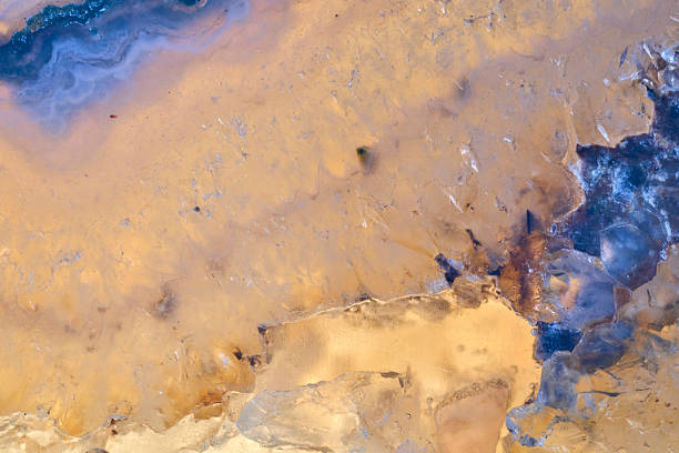 Agate macro detail. close-up of a textured semi-precious gemstone background. backlight transparency