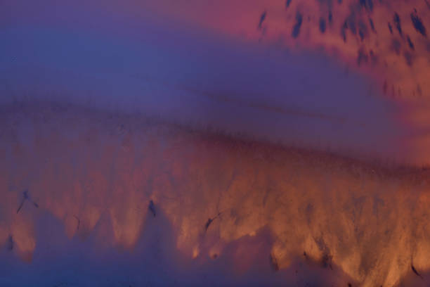 Agate macro detail. close-up of a textured semi-precious gemstone background. backlight transparency