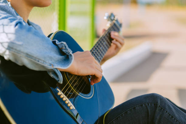High Angle View Of Guitar On Table