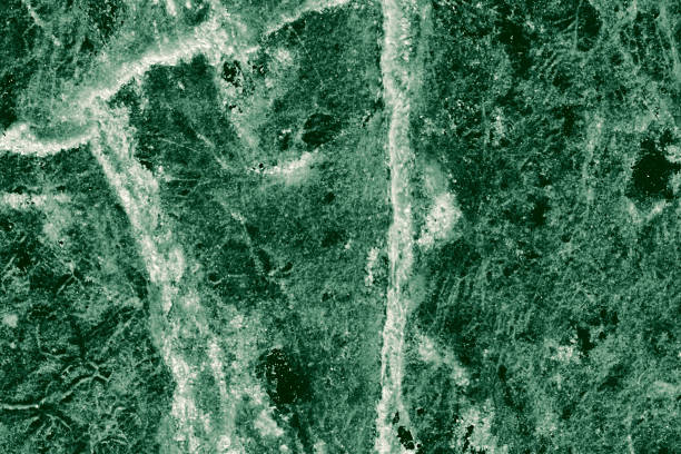 istock Real closeup of dark green marble stone texture surface background. Design pattern with high resolution for luxury home decoration. Abstract matt slab rock material. Front view of natural tiles stone surface. 2205886557