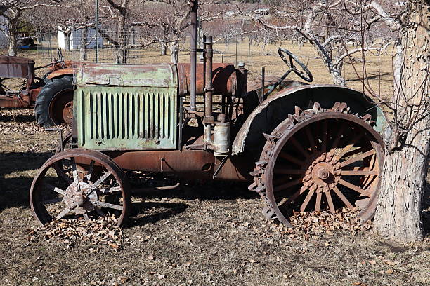 istock Old antique tractor on display on the side of a road. 2205887781