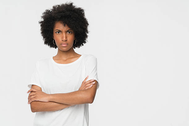 istock Confident Woman With Folded Arms Against Neutral Background Expressing Determination 2205894538