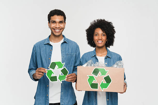 istock Smiling Individuals Promoting Recycling and Eco-Friendly Practices with Recycled Materials 2205895446