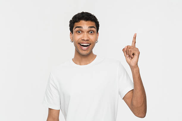 istock Cheerful Man Pointing Upwards in Excited and Surprised Moment 2205895540