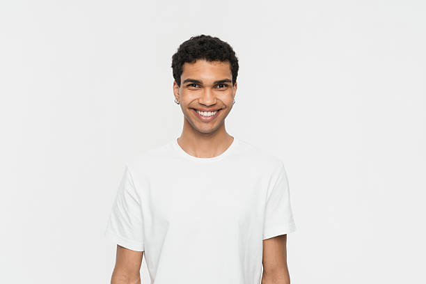 istock Smiling Young Man in White T-Shirt Against a Clean White Background 2205895548