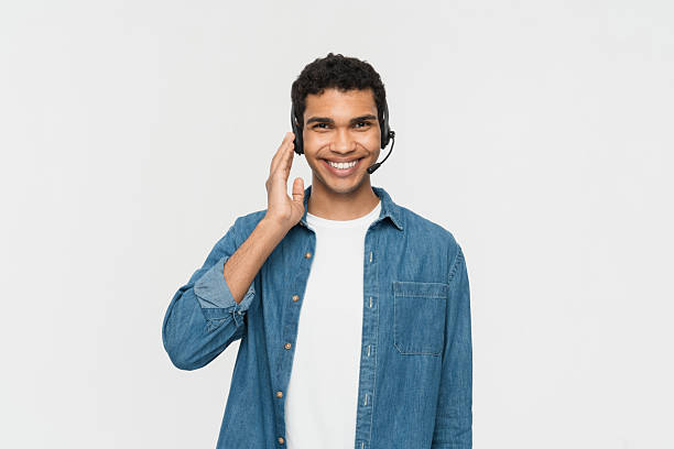 istock Smiling Call Center Agent Wearing a Headset in Casual Attire 2205895622