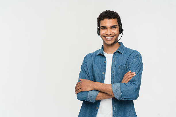 Smiling Support Representative in Casual Outfit with Headset on White Background