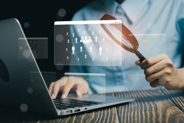 istock Searching Digital Data with Magnifying Glass and Laptop in Professional Environment, Business concept 2205896894
