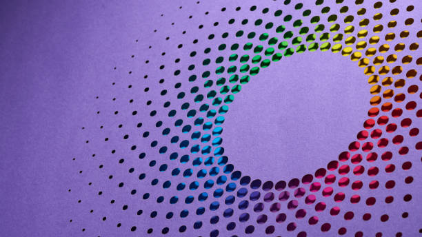 istock Abstract paper cutout artwork with circular perforations on purple background revealing a vibrant rainbow color gradient 2205897462