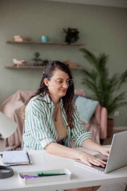 istock Empowered Woman in Home Office 2205902470