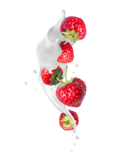 istock Strawberries in milk splashes close-up isolated on white background 2205904305