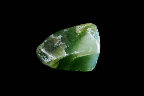 Green jade is a beautiful mineral symbolizing harmony and prosperity, close-up.