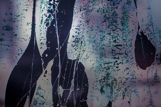 istock Close-up of broken LCD LED screen showing pixel distortion and texture, creating a digital drama effect. 2205906114