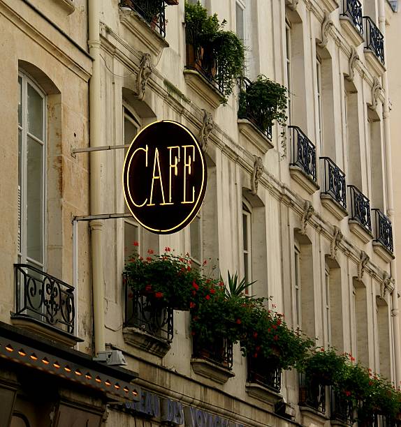 istock Cafe sign on building with flowers in Paris 2205913447