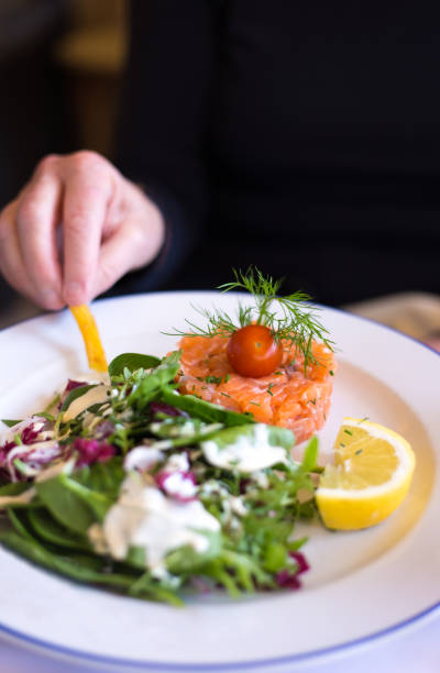 istock Paris, France: Salmon Tartare with Salad and Lemon 2205914839