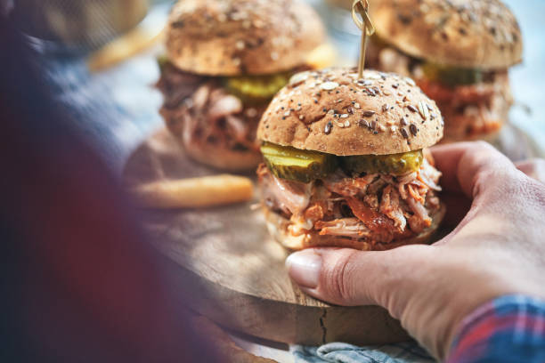 istock Pulled Pork Sliders with Pickles and Barbecue Sauce 2205917299