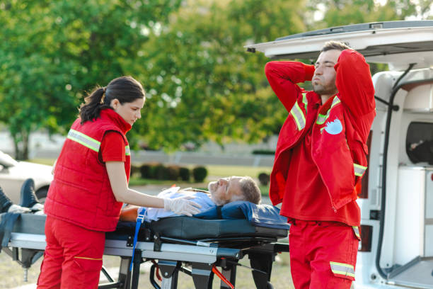 istock Emergency medical team assisting patient outdoors. Stressful day at work for young doctors 2205917660
