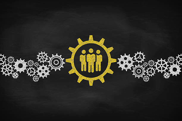 Cogwheels Concept With Team Leader. Chalk on the blackboard.