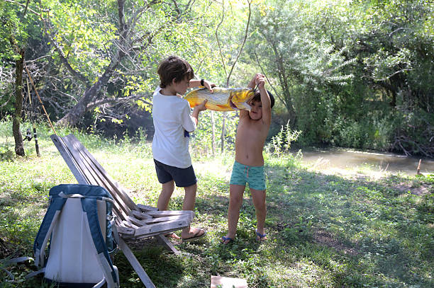 two kids with a big fish