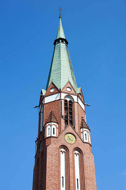 The tall spire with a clock of Garrison Church of St. George in Sopot resort town (Poland).
