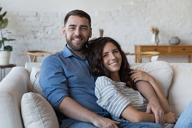 istock Happy attractive millennial married couple home portrait 2205920775