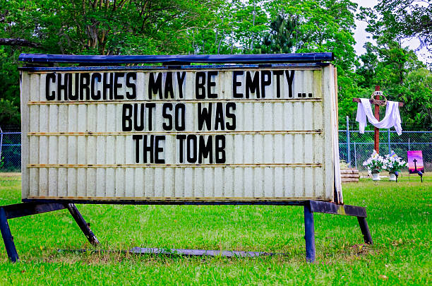 Coden, Alabama, USA - April 11, 2020: A sign at Coden United Methodist Church reminds people that though churches are closed this Easter due to Covid-19, Christ’s resurrection is a symbol of hope.