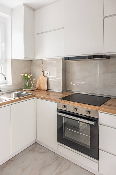 istock Counter top in modern kitchen. Style kitchen vanity sink with wood cabinets 2205921889