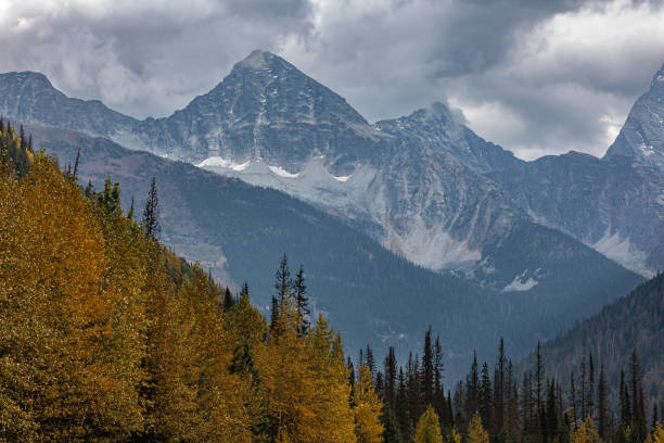 Scenic view of the mountains in Glacier National Park Canada. Snow Covered Canadian Mountain Landscape in Winter. Mountain Range between Jasper and Banff National Parks in an autumn