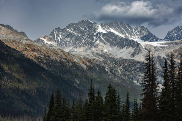 Scenic view of the mountains in Glacier National Park Canada. Snow Covered Canadian Mountain Landscape in Winter. Mountain Range between Jasper and Banff National Parks in an autumn