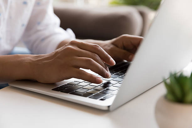 istock Cropped closeup shot unknown female employee work distant on laptop 2205926269