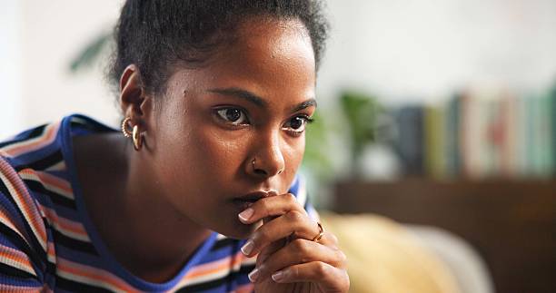 istock Thinking, home and serious woman with reflection, stress or contemplating decision. Planning, challenge and female person with worry, regret choice or student remember memory with exam fail in house 2205928872