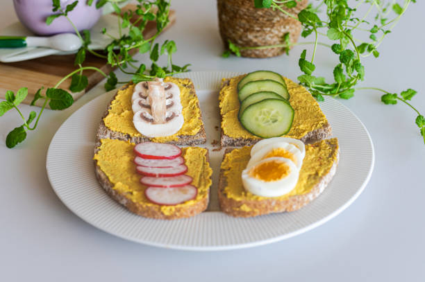 istock Delicious Hummus Sandwiches with Fresh Toppings 2205928923