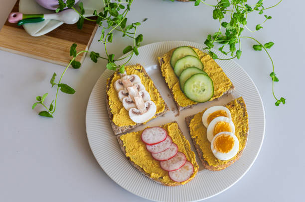 istock Delicious Hummus Sandwiches with Fresh Toppings 2205930067