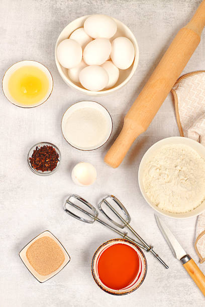 istock Cooking ingredients for making pie and bread, recipe with eggs, flour, sugar, honey, cinnamon, yeast and butter. Kitchen background of food preparation with space for text. Concept of modern bakery, 2205931186