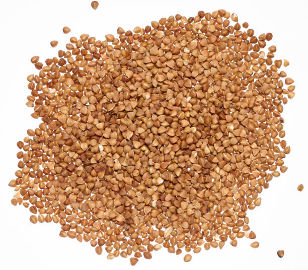 istock Raw buckwheat grains on isolated background, close up 2205936600