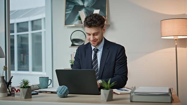 istock Office worker feeling success working on laptop at workplace smiling closeup. 2205936638