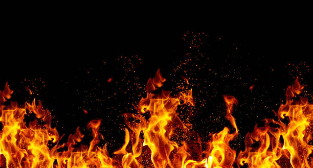 istock Bright orange flames and sparks on black background 2205936805