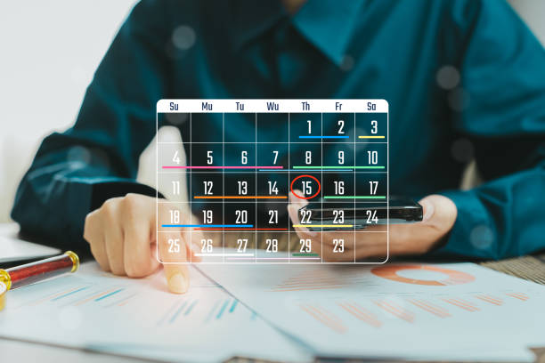 istock Business Professional Planning and Scheduling Important Tasks on a Calendar and Documents, Business concept 2205937866