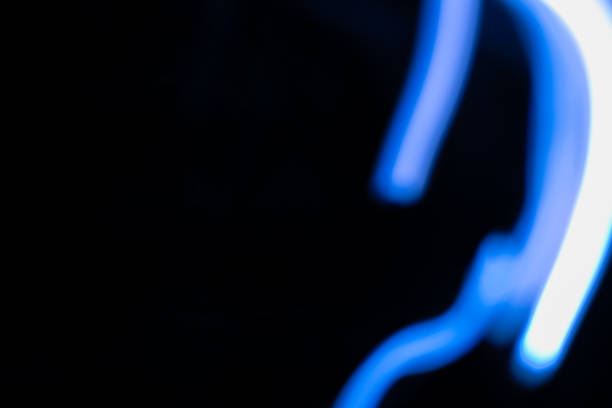 istock Abstract blue light trails painting the darkness 2205940767