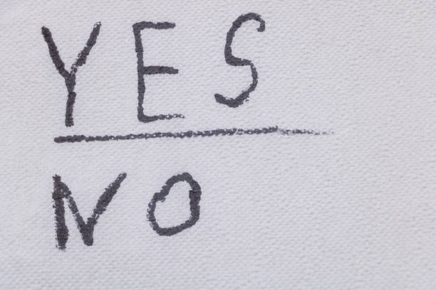 istock Yes and No concept, written with a marker on white paper 2205942103