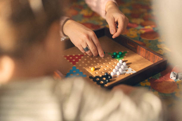 istock Family Connection. Multigenerational Family Plays Board Game 2205945019
