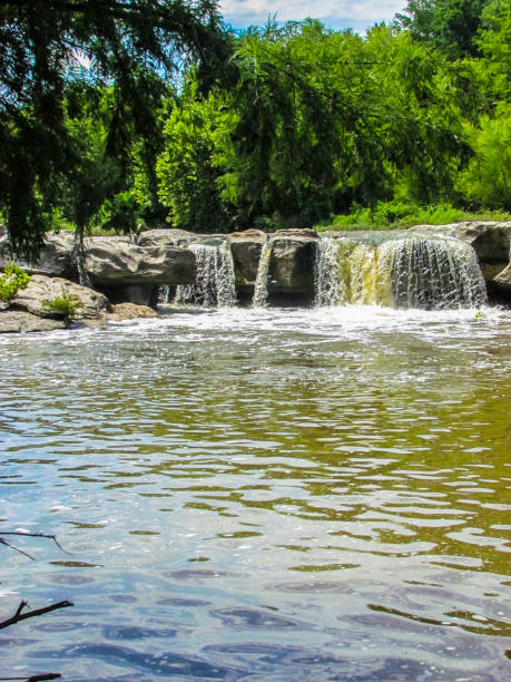 istock Waterfall Into With Large Gray Rock Into A Stream McKinney Falls 2205947910