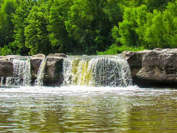 Waterfall Into With Large Gray Rock Into A Stream McKinney Falls