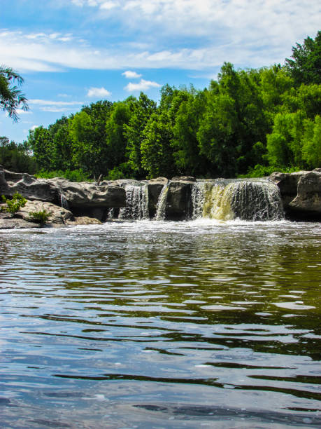 istock Waterfall Into With Large Gray Rock Into A Stream McKinney Falls 2205947916