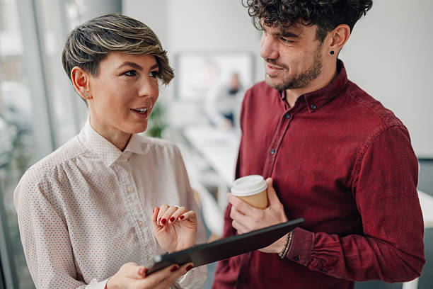 istock Business colleagues using digital tablet and discussing in office 2205951907