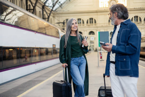 istock Mature duo having fun at the station while on their travels 2205952617